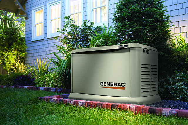 Generac home standby generator installed beside a house, shown as an example for generator sizing.